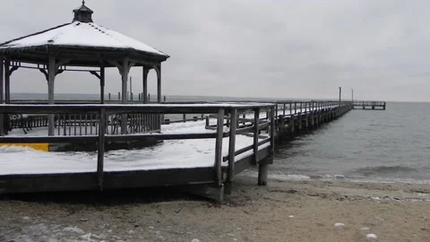 Windy Winter Day With Snow Covered Pier And Choppy River Water Stock Footage 149118426