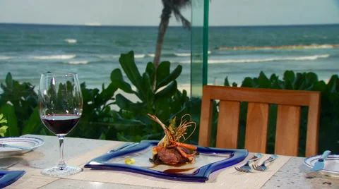 Wine and appetizer set on table near seashore Stock Footage 57814567