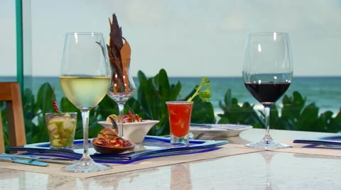 Wine and appetizer set on table near seashore Stock Footage 57814599