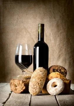 Wine and assortment of bread Stock Photos
