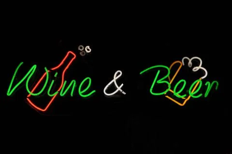 Wine and beer neon sign Stock Photos