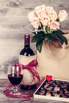 Wine and box of chocolates Stock Photos