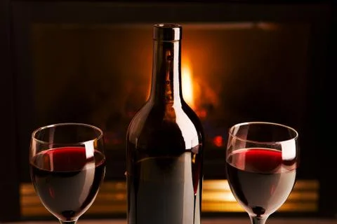 Wine and fireplace Stock Photos
