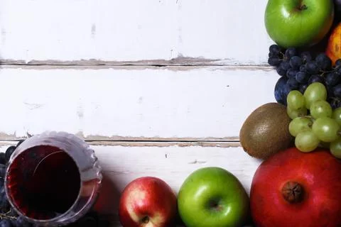 Wine and fruit on the table Stock Photos
