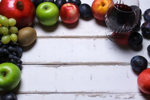 Wine and fruit on the table Stock Photos