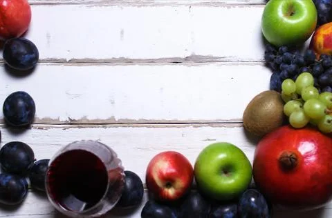 Wine and fruit on the table Stock Photos