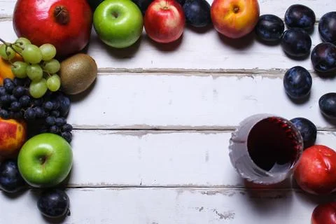 Wine and fruit on the table Stock Photos