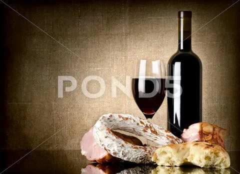 Wine and sausage, bread Stock Photos