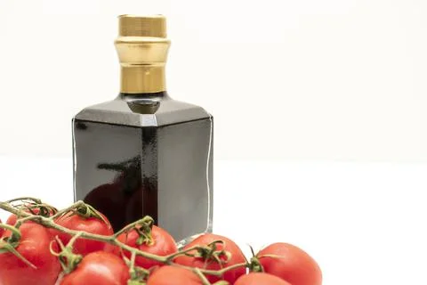 Wine and tomatoes Stock Photos