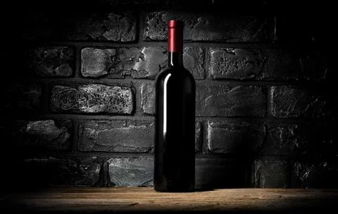Wine and wall of bricks Stock Photos