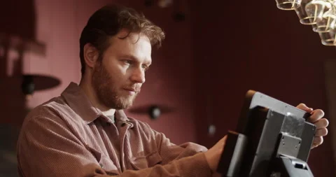 Wine bar owner using computer at counter checking orders Stock Footage 239167226