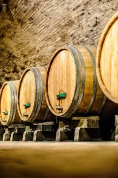 Wine barrels in an aging cellar 写真素材