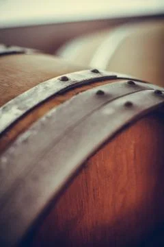 Wine barrels in a cellar Stock Photos