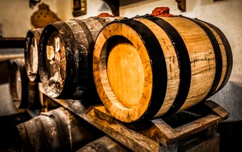 Wine barrels in cellar. Stock Photos
