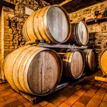 Wine barrels in cellar. Stock Photos