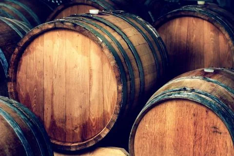 Wine barrels in a cellar Stock Photos