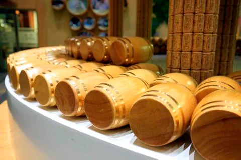 Wine barrels stacked in the cellar Stock Photos