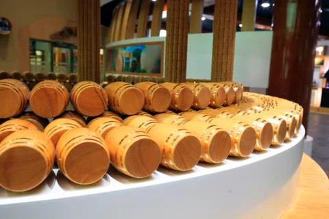 Wine barrels stacked in the cellar Stock Photos