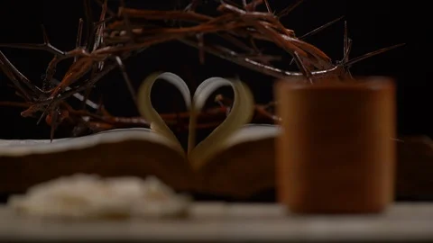 Wine being Poured beside Bread with Bible and crown in Background, Shallow DOF Stock-Footage 128594177