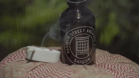 Wine bottle and a cigarette Stock Footage 146362822