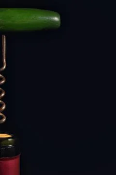 Wine Bottle And Corkscrew Isolated On Black Stock Photos