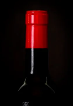 Wine bottle on black background Stock Photos