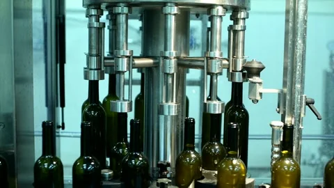Wine bottle conveyor system processing during manufacturing at a beverage Stock Footage 305877628