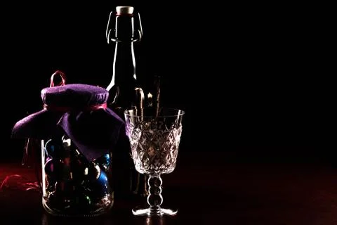 Wine in a bottle. A decor from a tree. Spheres in bank. Stock Photos