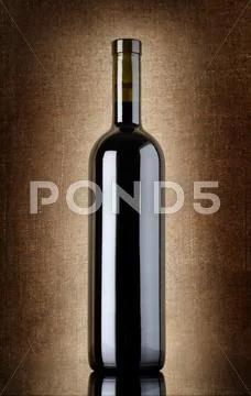 Wine bottle on a old canvas Stock Photos