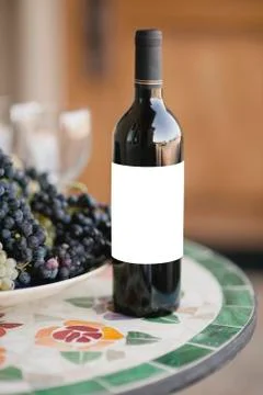 Wine Bottle Standing on the Table with Blank Label Stock Photos