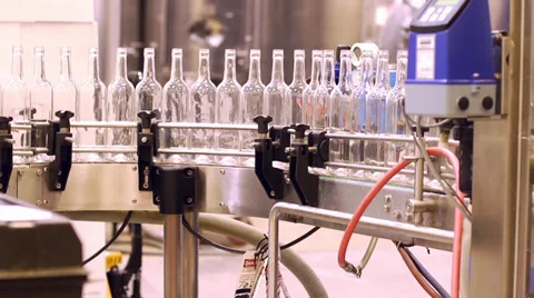 Wine bottles about to be filled at the plant Stock Footage 32546639