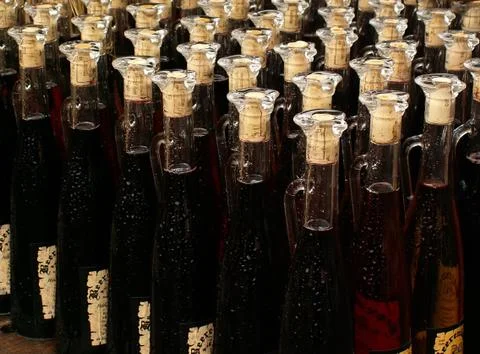 Wine bottles aligned on the table Stock Photos
