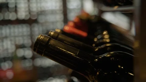 Wine Bottles Arranged on Rack in Beijing Restaurant Cellar Close-Up Stock Footage 345780647
