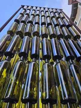 Wine bottles arranged vertically in a pattern as a work of art in Napa Foto stock
