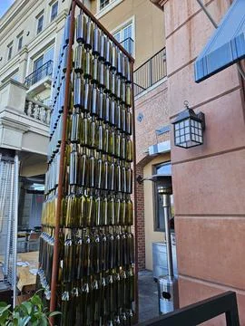 Wine bottles arranged vertically in a pattern as a work of art in Napa Stock Photos