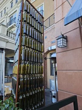 Wine bottles arranged vertically in a pattern as a work of art in Napa Stock Photos