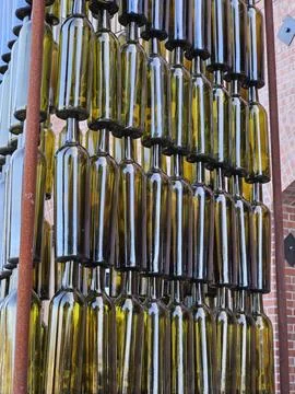 Wine bottles arranged vertically in a pattern as a work of art in Napa Stock Photos