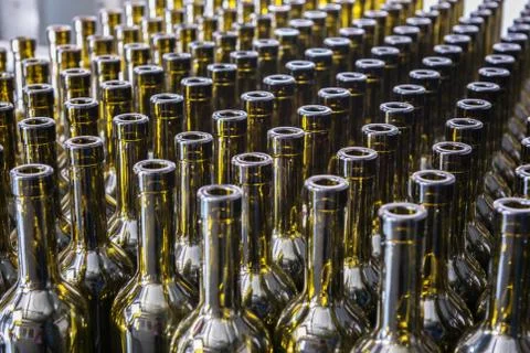 Wine bottles background, winemaking process, preparing wine for bottling in a 库存照片