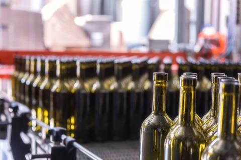 Wine bottles background, winemaking process, preparing wine for bottling in a Stock Photos