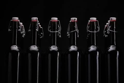 Wine bottles on black background . Stock Photos