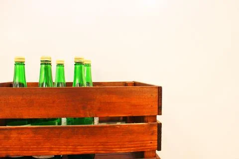 Wine bottles in a box close up. Box with bottles of drink in a wooden box on a Stock Photos