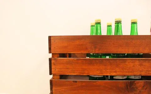 Wine bottles in a box close up. Box with bottles of drink in a wooden box on a Stock Photos