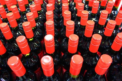 Wine bottles in a box close up. Box with bottles of drink in a wooden box on a Stock Photos