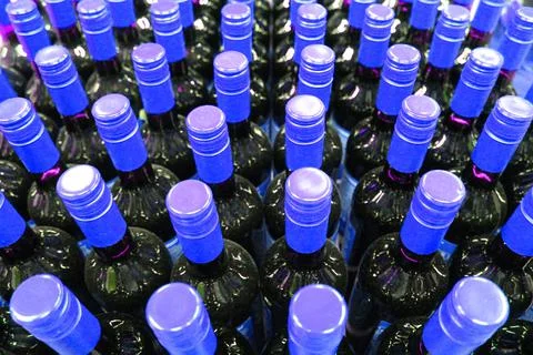 Wine bottles in a box close up. Box with bottles of drink in a wooden box on a Stock Photos