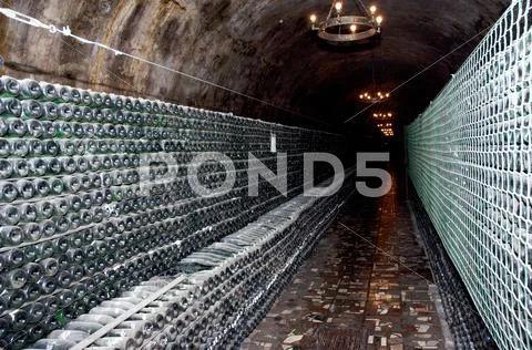 Wine bottles in a cellar Stock Photos
