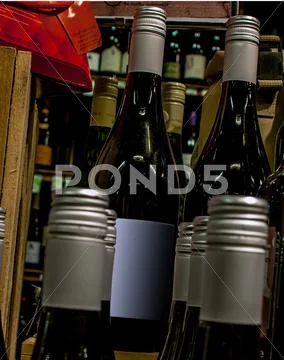 Wine bottles on display at store Stock Photos