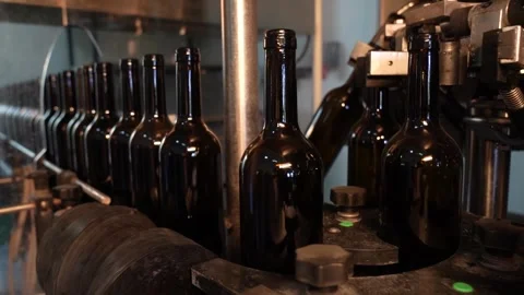 Wine Bottles Moving on Bottling Conveyor Belt in Industrial Factory Stock Footage 323189613