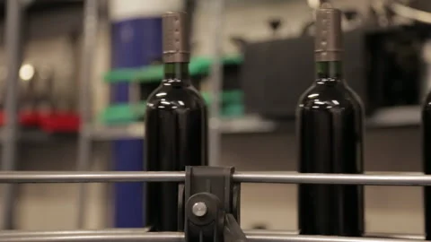 Wine bottles passing by in the bottling machine Stock Footage 142736744