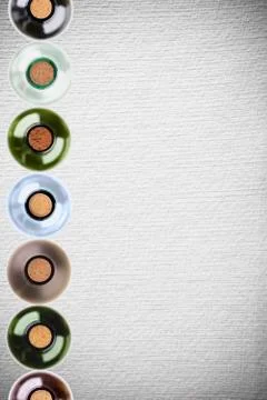 Wine bottles on pattern paper background Stock Photos