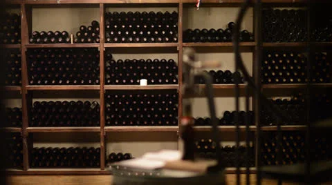 Wine bottles on a shelf - dolly shot Stock Footage 24180751